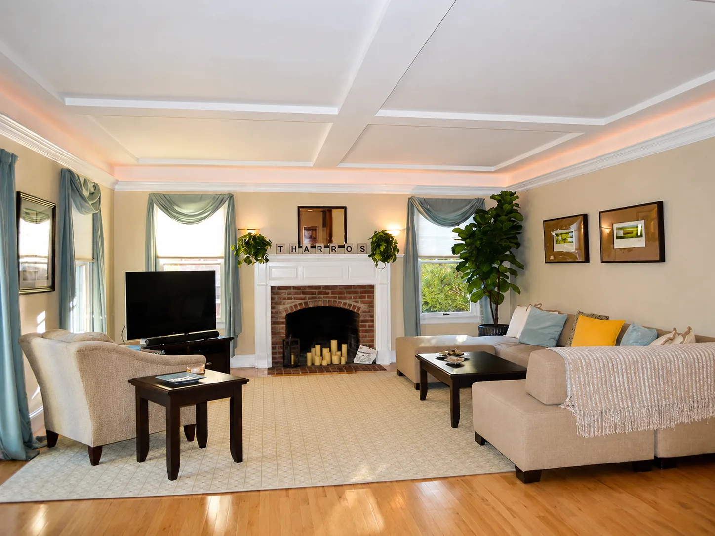 Cozy living room with fireplace at Tharros House