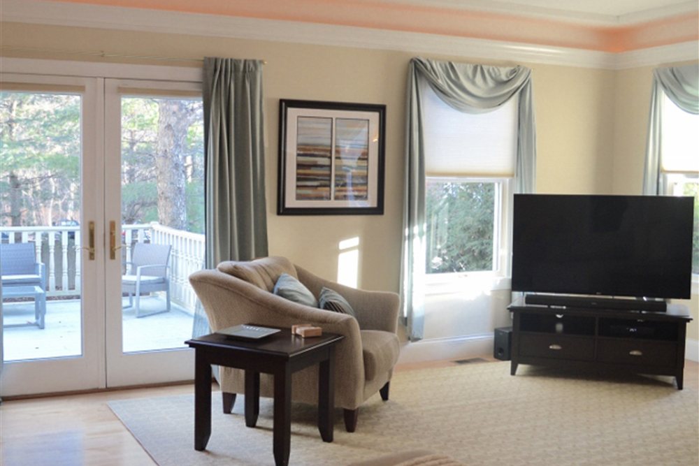 A bright, comfortable common living room at Tharros House.